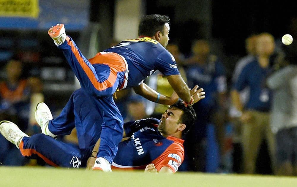 Delhi Daredevils players Amit Mishra and Zaheer Khan drop the catch during an IPL match in Mumbai.