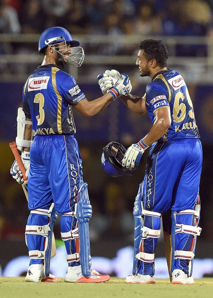 Rajasthan Royals player Ajinkya Rahane greets Karun Nair for scoring half century during an IPL match in Mumbai.