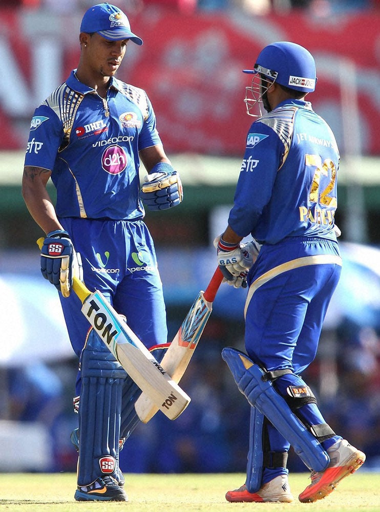 Lendl Simmons of Mumbai Indians congratulates Parthiv Patel of Mumbai Indians for reaching his fifty during IPL match against Kings XI Punjab in Mohali.