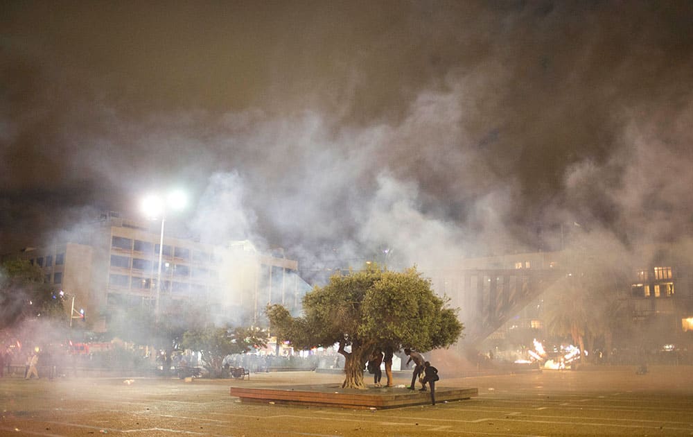 Israel's Jewish Ethiopians clash with Israeli riot police during a protest against racism and police brutality in Tel Aviv, Israel,  as several thousand people from Israel's Jewish Ethiopian minority protested in Tel Aviv, shutting down a major highway and clashing with police on horseback long into the night.