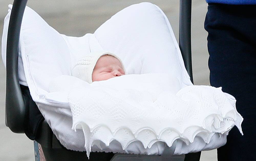 Britain's Prince William and Kate, Duchess of Cambridge, hold their newborn daughter as they as they pose for the media outside St. Mary's Hospital's exclusive Lindo Wing, London.