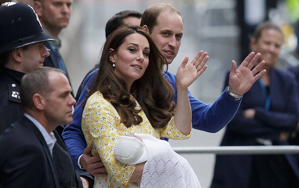 Britain's Prince William and Kate, Duchess of Cambridge and their newborn baby princess, wave to the public as they leave St. Mary's Hospital's exclusive Lindo Wing in London.