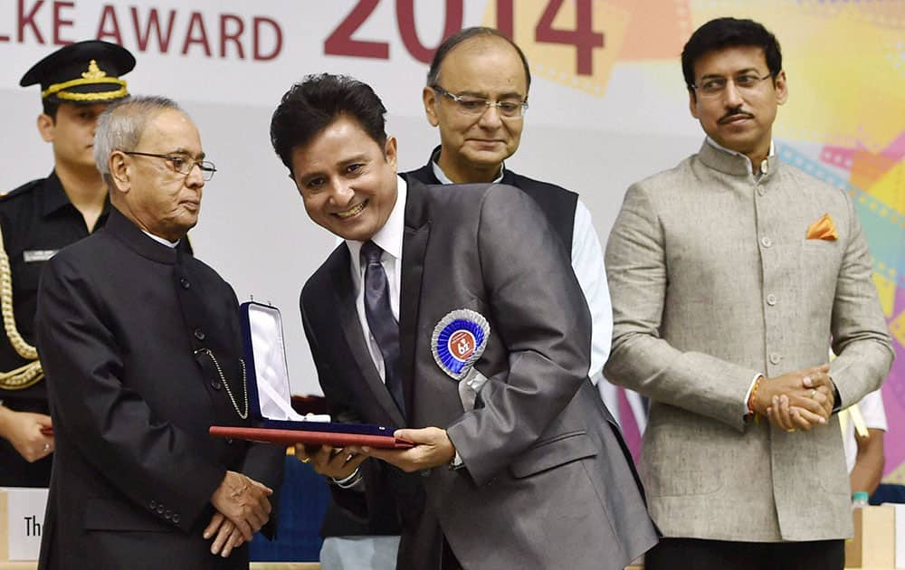 President Pranab Mukherjee presenting 62nd National Film Award for Best male playback singer for film Haider to Sukhwinder Singh at the award ceremony in New Delhi.