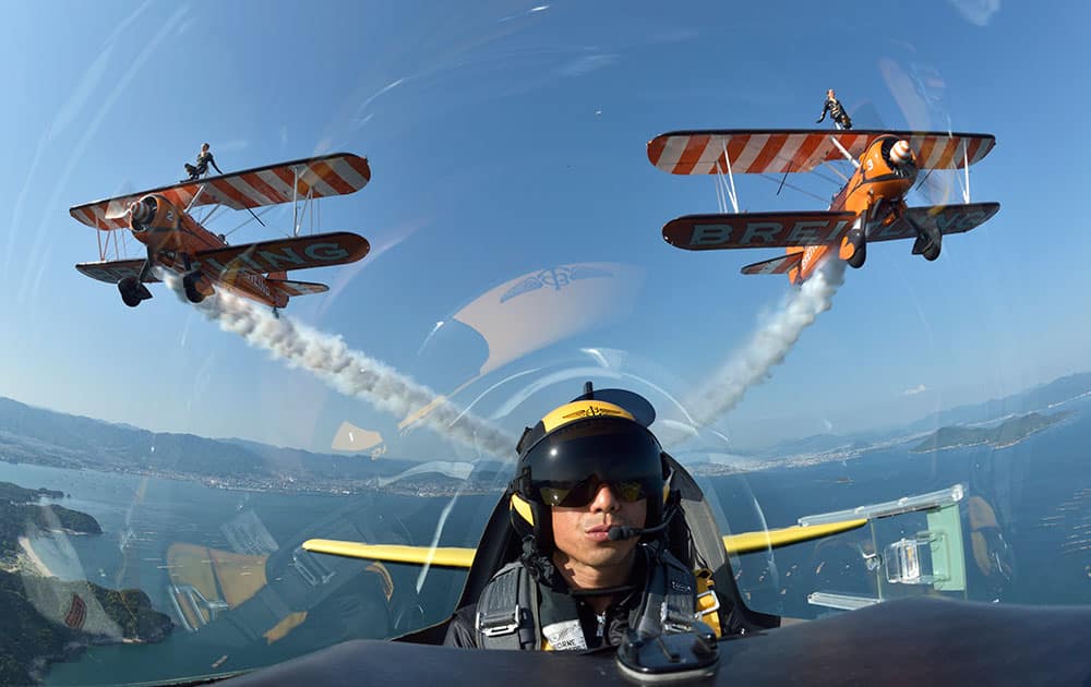 The Breitling Wing Walking team celebrated their first flights in Japan by flying in formation with Japanese Red Bull Air Race Pilot Yoshihide Muroya, flying his Breitling Extra 300L aircraft over the Seto Inland Sea close to Hiroshima, Japan.