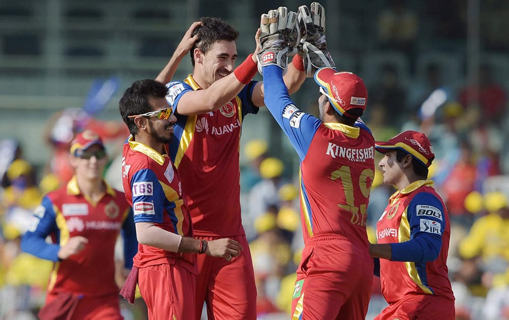 Royal Challengers Bangalore‘ player Mitchell Starc celebrating the wicket of Chennai Super Kings Dwayne Smith during their IPL match at MAC Stadium in Chennai.
