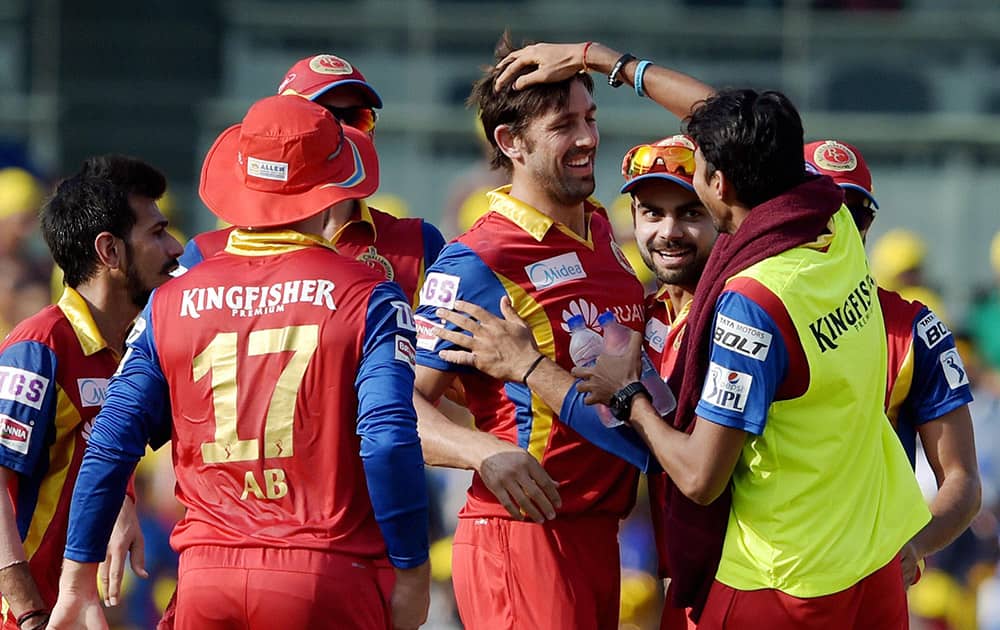 Royal Challengers Bangalore‘s David Wiese celebrating along with teammates the wicket of Chennai Super Kings Brendon McCullum during their IPL match at MAC Stadium in Chennai.