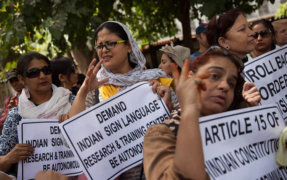 Deaf and hearing impaired women gesture during a protest in New Delhi. The protest against the government’s decision to demand that the Indian Sign Language Research and Training Centre (ISLRTC) be autonomous and managed by the National Association of Deaf (DAF)