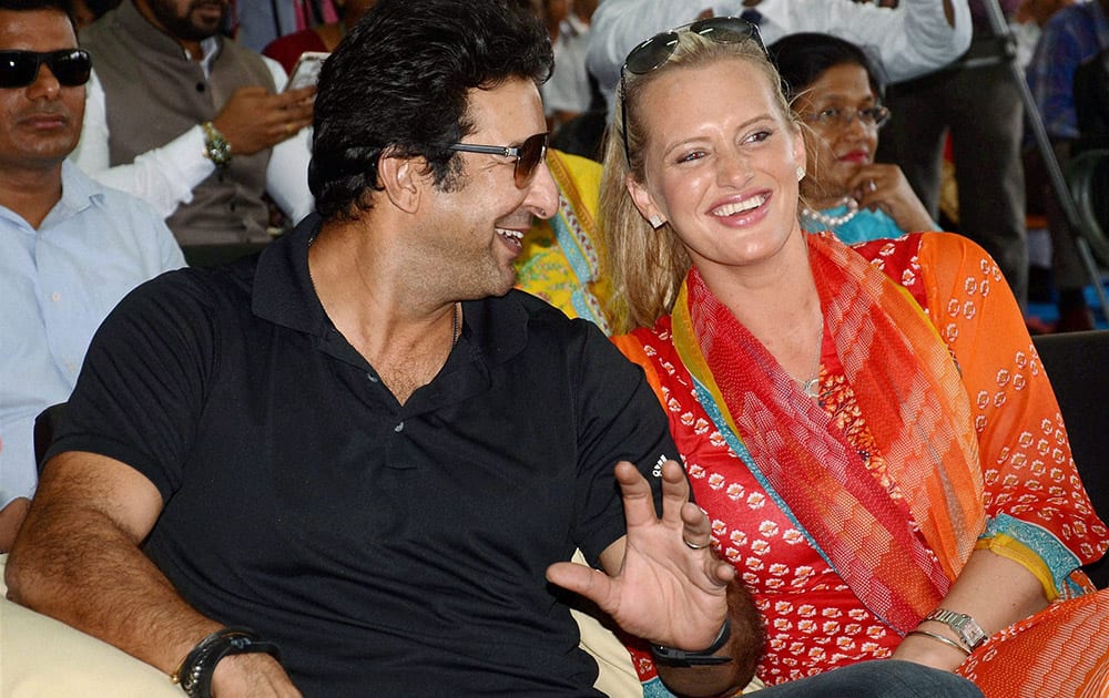 Former Pakistani cricketer Wasim Akram with his Australian wife Shaniera Thompsom in a school programe in Kolkata.