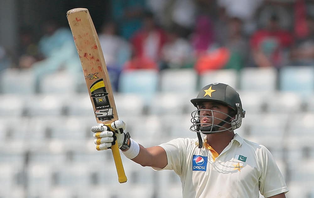 Pakistan’s Azhar Ali acknowledges the crowd after scoring a half-century on the first day of the second test cricket match against Bangladesh in Dhaka, Bangladesh.