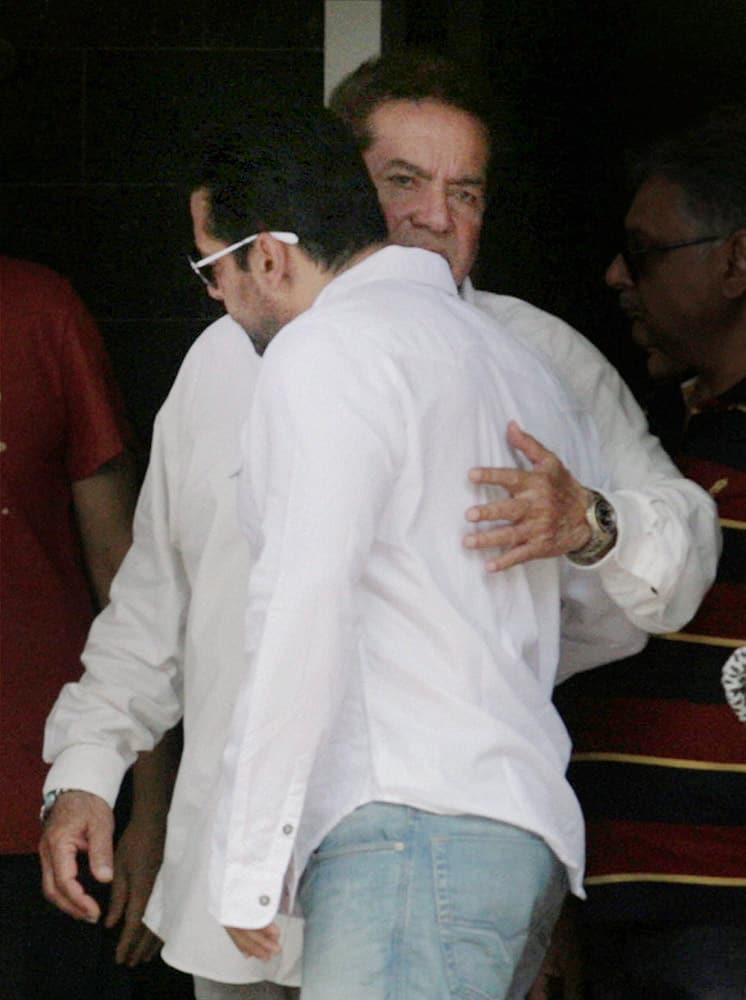 Salman Khan being hugged by his father Salim Khan before left from his residence Galaxy apartment for Court to attend his hit and run case verdict in Mumbai.