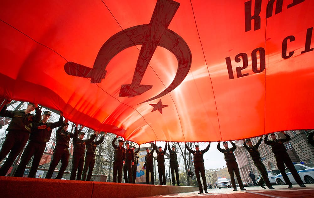 Cadets hold an enlarged copy of the Banner of Victory during a celebration of the upcoming Victory Day in St.Petersburg, Russia. Victory Day, marking the 70th anniversary of defeating of Nazi Germany will be celebrated on May 9 in Russia. 