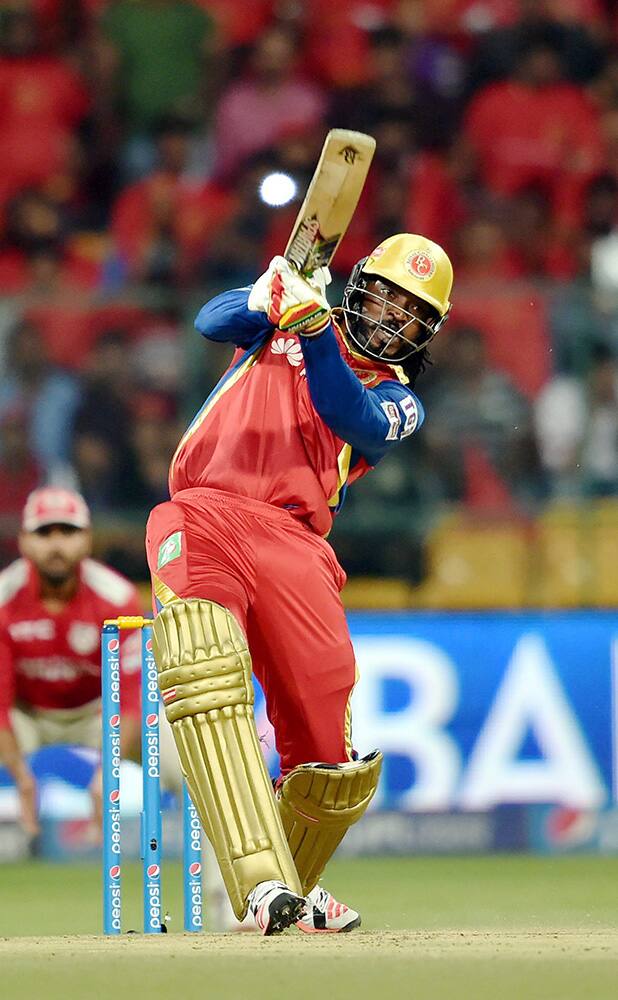 Royal Challengers Bangalore player Chris Gayle plays a shot during IPL 8 match against Kings XI Punjab in Bengaluru.