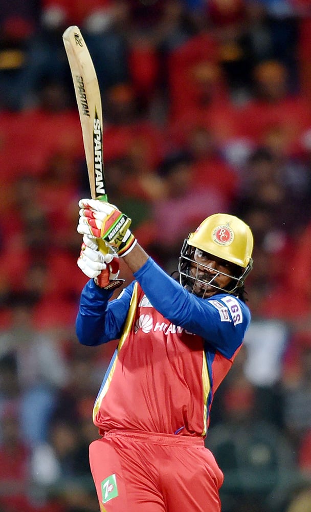 Royal Challengers Bangalore player Chris Gayle plays a shot during IPL 8 match against Kings XI Punjab in Bengaluru.