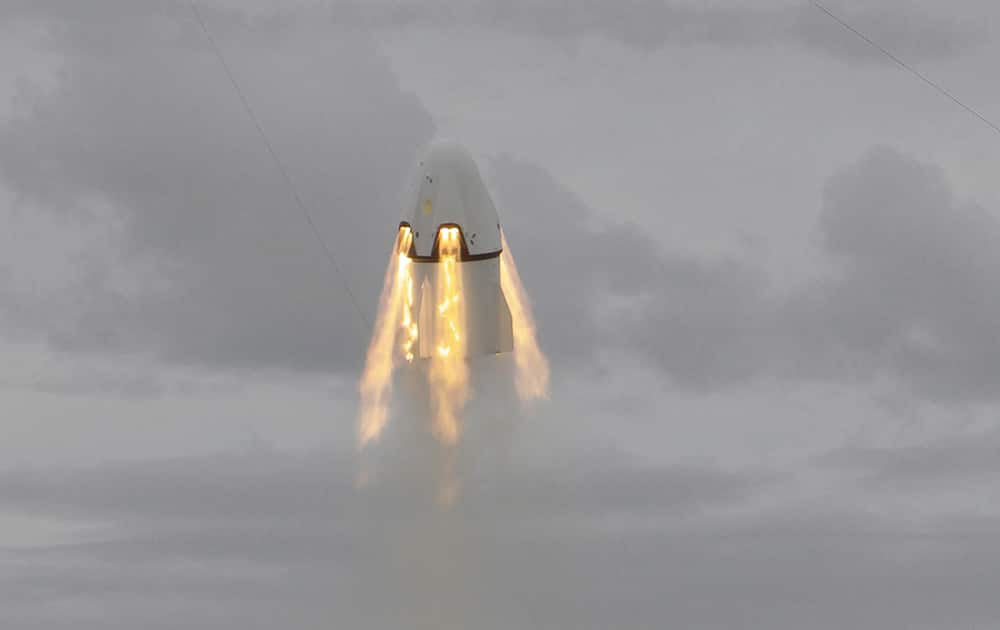 SpaceX's Dragon capsule launches, from Cape Canaveral, Fla. SpaceX fired the mock-up capsule to test the new, super-streamlined launch escape system for astronauts.