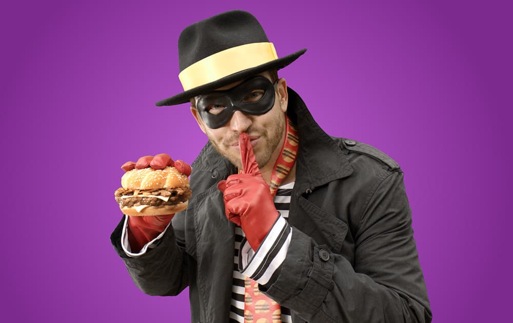 In this product image provided by McDonald’s one of the McDonald’s mascots the Hamburglar poses for a photo. The company is bringing the burger thief back to its advertising after a 13-year absence.