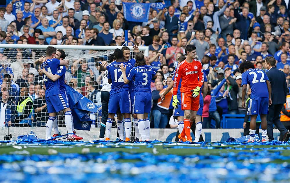 Chelsea players celebrate after the English Premier League soccer match between Chelsea and Crystal Palace at Stamford Bridge stadium in London.