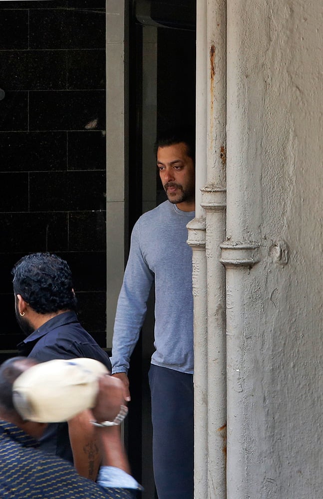 Salman Khan comes out of his residence to see off a guest in Mumbai.