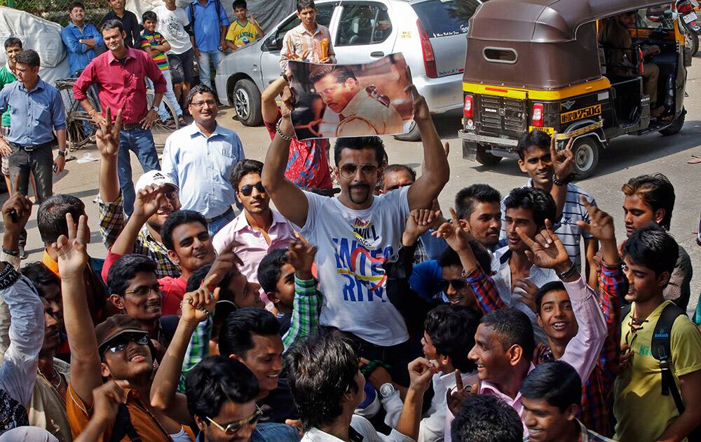 Fans of Bollywood actor Salman Khan gather outside his residence in Mumbai.