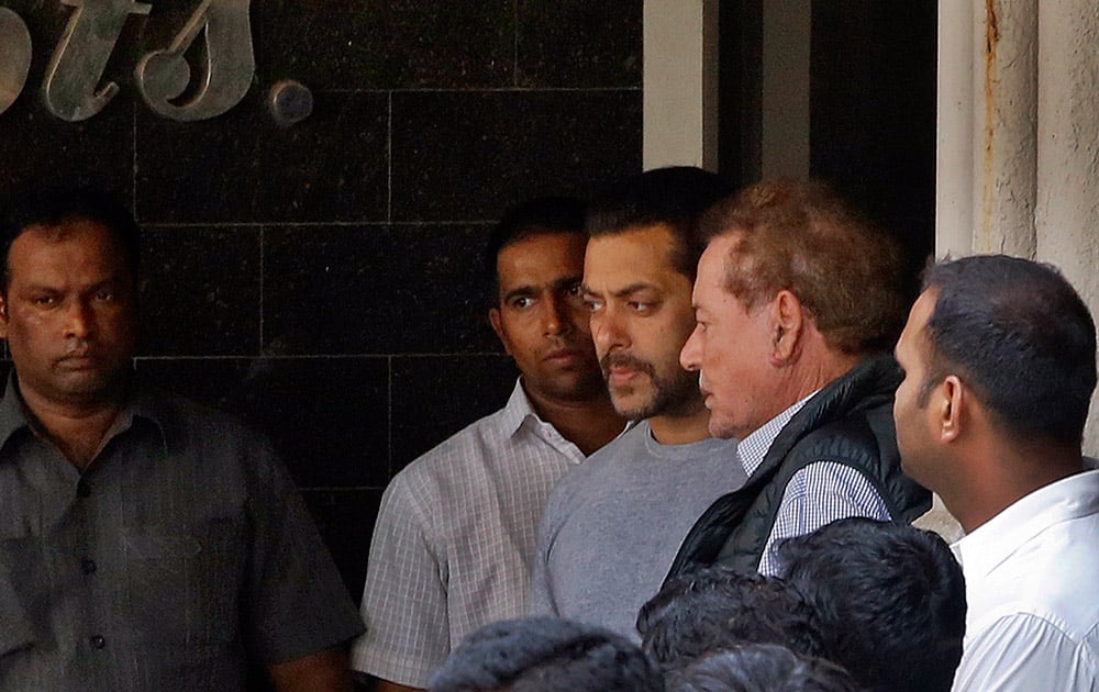 Salman Khan and his father Salim Khan come out of their residence to see off a guest in Mumbai.