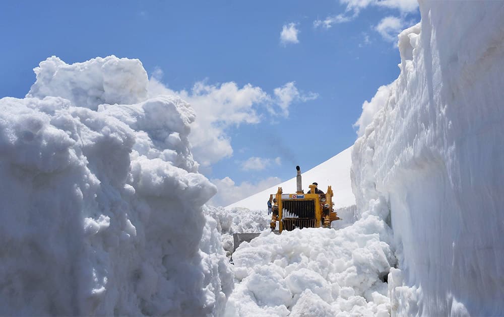 The snow is being cleared from Rohtang Pass on Manali - Keylong - Leh Highway.