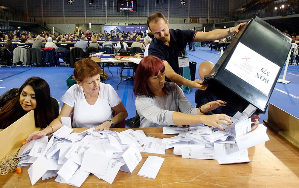 The first votes arrive at the general election count for the Glasgow constituencies at the Emirates Arena in Glasgow, Scotland.