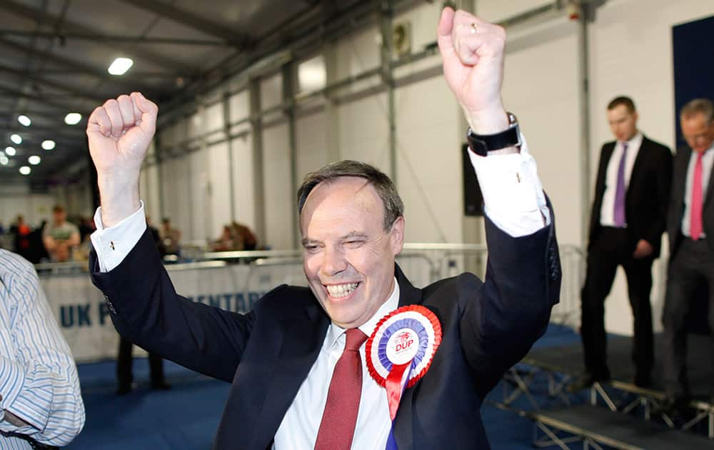 Democratic Unionist Party candidate for North Belfast Nigel Dodds celebrates after being elected MP for North Belfast at the Kings Hall count center, in Belfast, Northern Ireland.