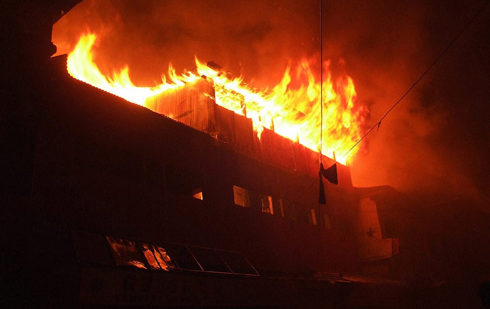 Fire fighters tries to control major fire which broke out from a shopping complex at Lambert Lane.