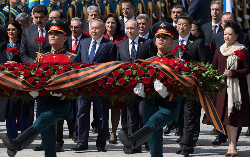 Venezuelan President's wife Cilia Flores, Venezuela's President Nicolas Maduro, Kazakh President Nursultan Nazarbayev, Russian President Vladimir Putin, Chinese President Xi Jinping and Chinese first lady Peng Liyuan attend a wreath-laying ceremony at the Tomb of the Unknown Soldier in Moscow after the Victory Parade marking the 70th anniversary of the defeat of the Nazis in World War II, in Red Square, Moscow, Russia.