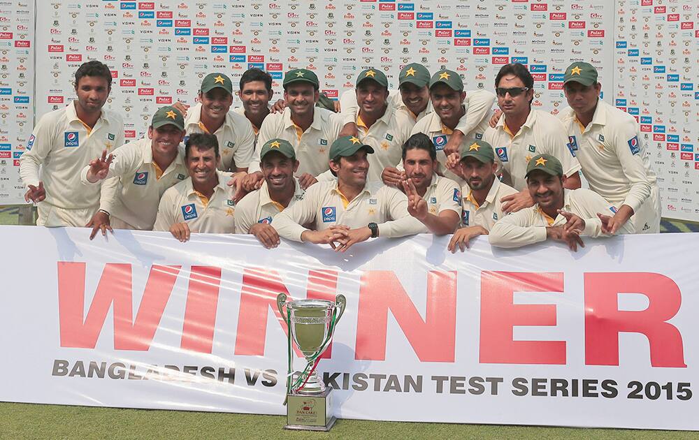 Pakistan’s cricket players pose for a group photograph with the winner's trophy for their series against Bangladesh in Dhaka, Bangladesh.