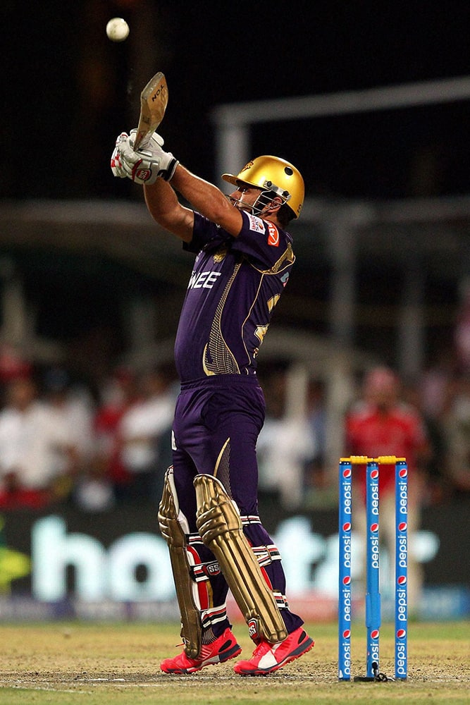 Piyush Chawla of the Kolkata Knight Riders ramps the ball for four during IPL match against Kings XI Punjab in Kolkata.