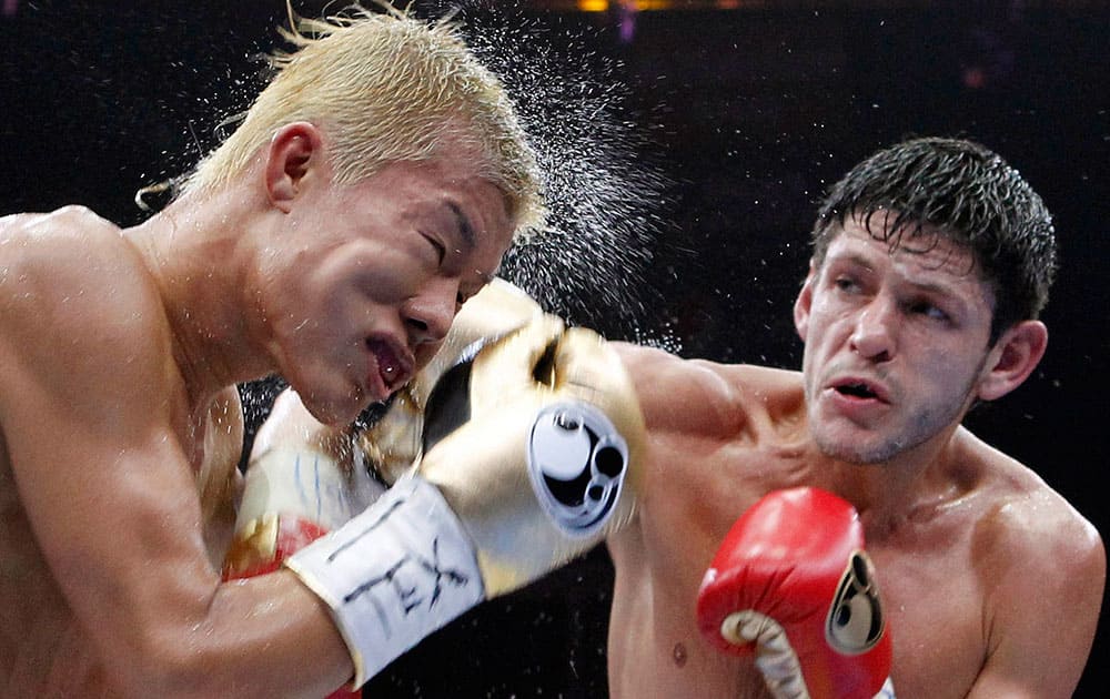 Tomoki Kameda, left, is struck by Jamie McDonnell during the eighth round of their bantamweight bout, in Hidalgo, Texas. McDonnell won the bout. 