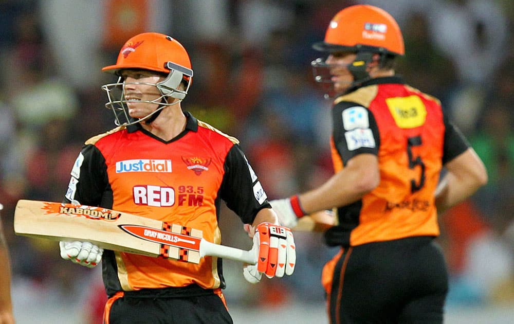 David Warner and Moises Henriques of the Sunrisers Hyderabad running between the wickets during the IPL 8 match against Kings XI Punjab in Hyderabad.