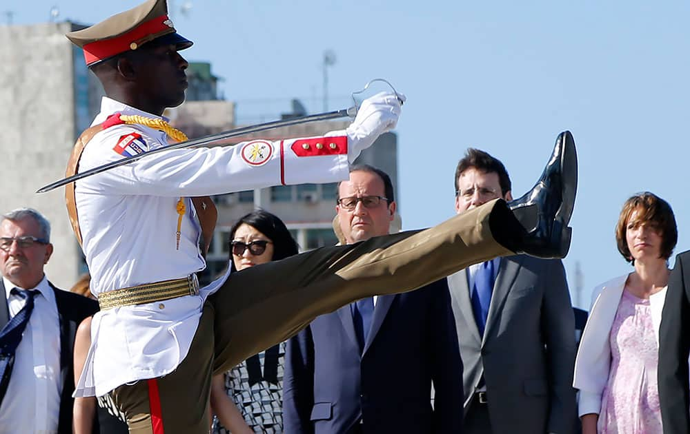 French President Francois Hollande, center, and members of his delegation attend a ceremony at the Jose Marti Memorial in Revolution Square in Havana, Cuba.