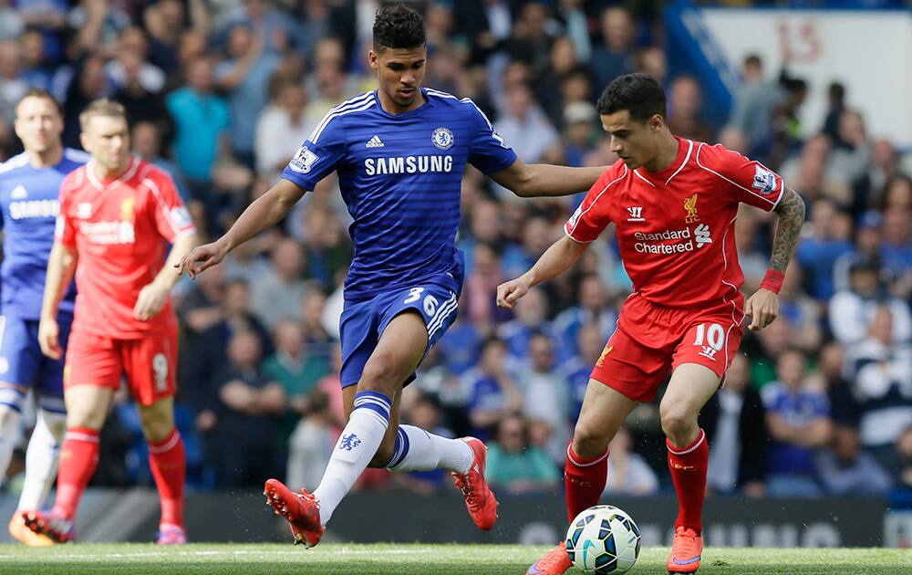 Chelsea’s Ruben Loftus-Cheek, left, competes for the ball with Liverpool’s Philippe Coutinho during the English Premier League soccer match between Chelsea and Liverpool at Stamford Bridge, London.