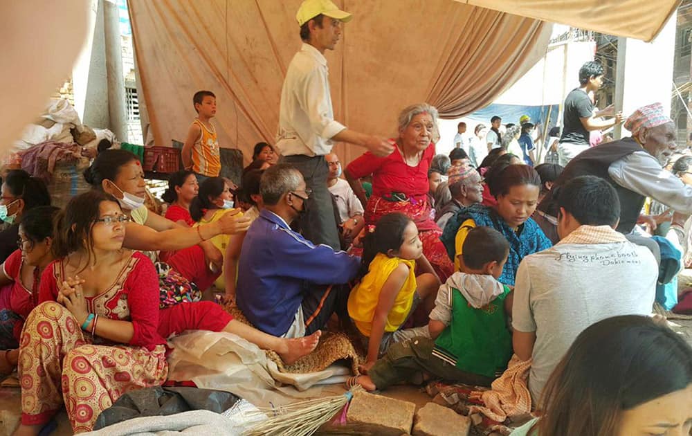 Nepalese people gather in a temporary shelter after another earthquake in Bhaktapur, Nepal.