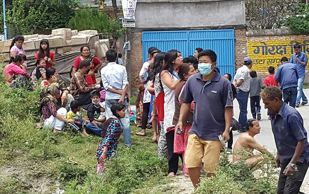 People gather in the street after an earthquake in Kathmandu, Nepal.