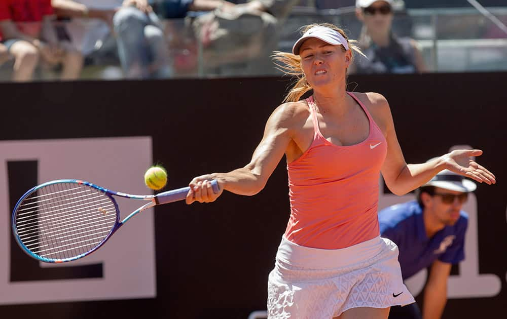 Russia's Maria Sharapova returns the ball to Australia's Jarmila Gajdosova during their match at the Italian Open tennis tournament, in Rome.