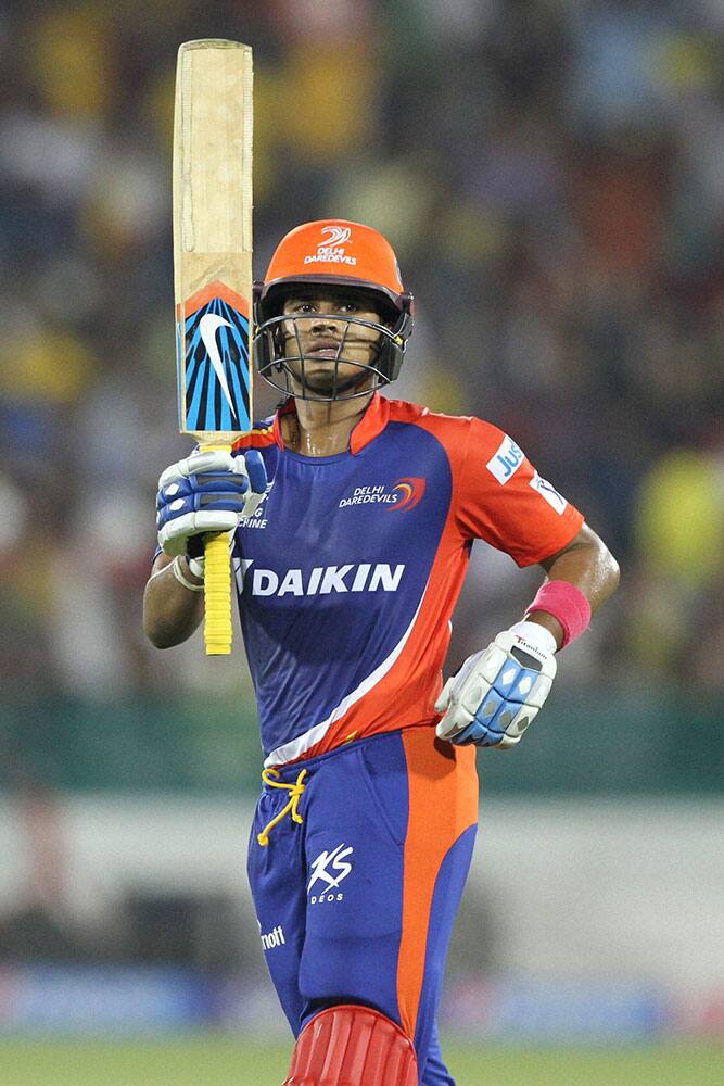 Shreyas Iyer of the Delhi Daredevils raises his bat after scoring 50 runs during an IPL 8 match against Chennai Super Kings in Raipur.