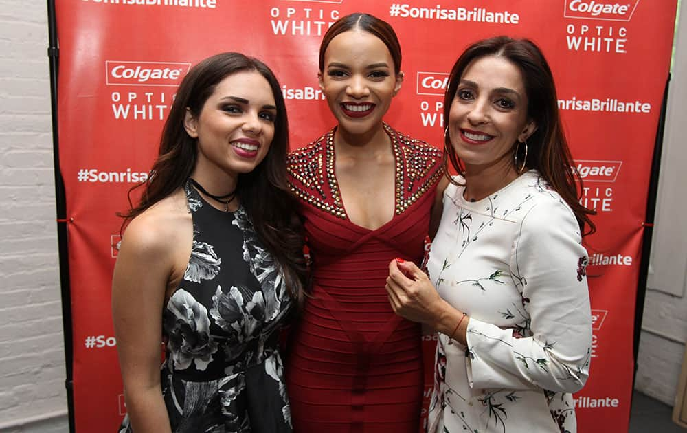 From left, Optic White Chicas Blogueras Daniela Ramirez, Artist Leslie Grace, and Optic White Chicas Blogueras Kika Rocha, seen at the Colgate Optic White Bar de Belleza at Haven's Kitchen in New York City.