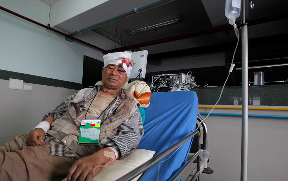 Bala Ram Nakarmi, 77, who was injured in Tuesday’s earthquake, receives treatment at the Bir hospital in Kathmandu, Nepal.