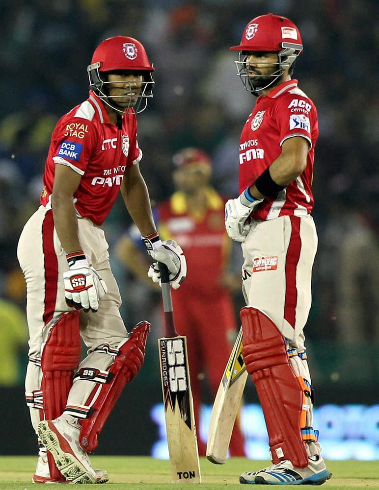 Wriddhiman Saha of the Kings X1 Punjab with Manan Vohra during IPL 8 match against Royal Challengers Bangalore in Mohal.