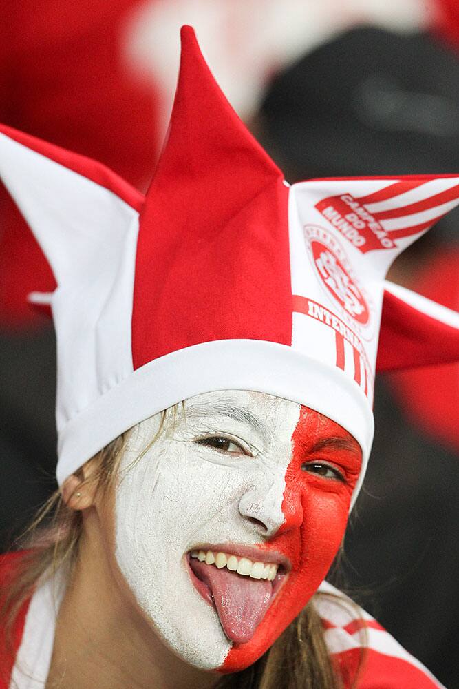 A soccer fan of Brazil's Internacional, poses for a photo before the start of a Copa Libertadores round of sixteen soccer match against Brazil's Atletico Mineiro in Porto Alegre, Brazil.