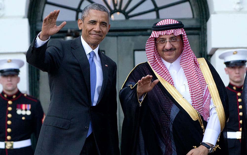 President Barack Obama, left, and Crown Prince Mohammed bin Nayef bin Abdulaziz Al Saud, Deputy Prime Minister and Minister of the Interior of the Kingdom of Saudi Arabia, wave to media as Mohammed bin Nayef bin Abdulaziz Al Saud arrives at the South Lawn of the White House in Washington.