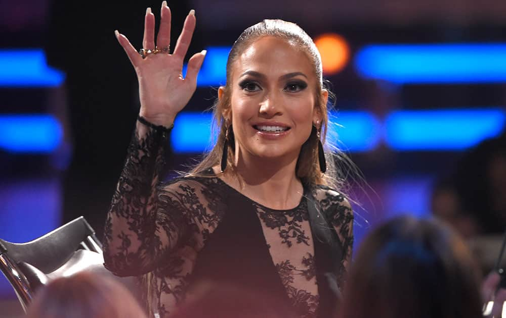 Jennifer Lopez waves to fans at the American Idol XIV finale at the Dolby Theatre in Los Angeles.