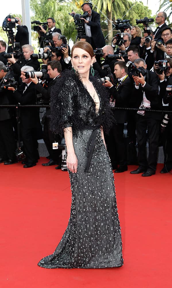 Actress Julianne Moore poses for photographers on the red carpet at the opening ceremony and the screening of the film La Tete Haute (Standing Tall) at the 68th international film festival, Cannes.