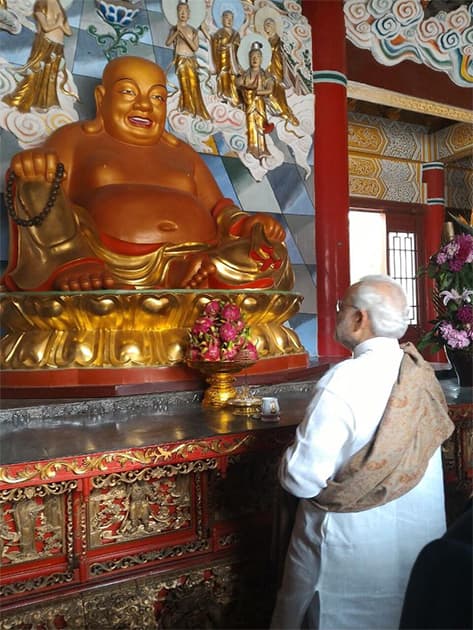 Traversing centuries. From the 2nd century BCE to 2nd century CE. PM @narendramodi at Daxingshan temple . Twitter@PIB_India