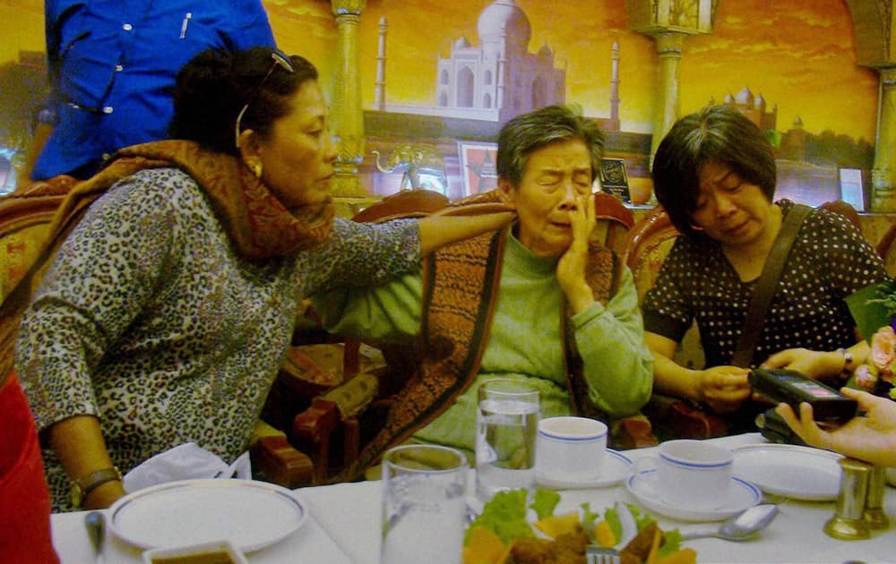 Indian woman from Chennai, Jennifer An consoling her step sister from China An Roesai (81) as they united in Beijing on Wednesday after about 75 years after their father left for India and settled in Chennai where he remarried a local woman. Jennifer came along with her husband V R S Balaji to search for Roesai on the sideline of Prime Minister Narendra Modis visit to China.