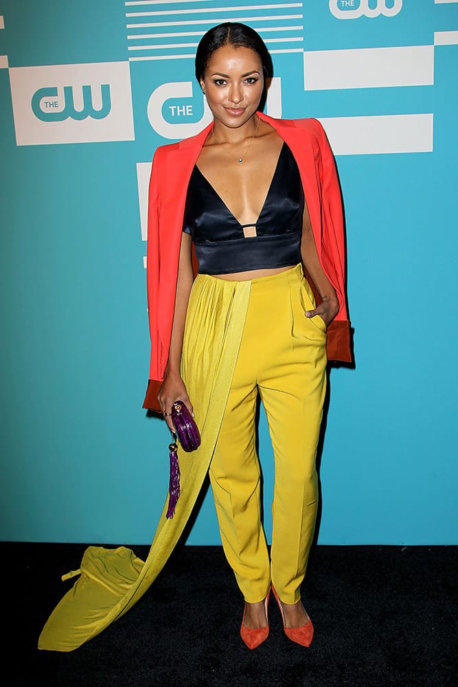 In this image released by Starpix, Kat Graham arrives at the 2015 CW Upfront Presentation at the London Hotel