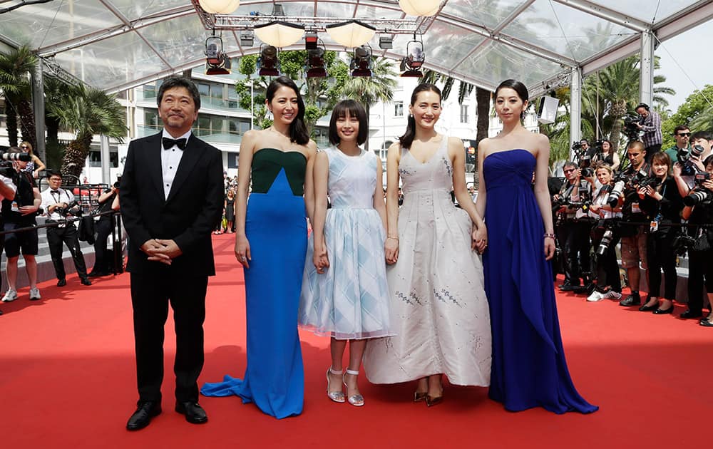 Actors Khao, Haruka Ayase, Suzu Hirose, Masami Nagasawa and director Hirokazu Kore-Eda pose for photographers as they arrive for the screening of the film Our Little Sister at the 68th international film festival, Cannes.