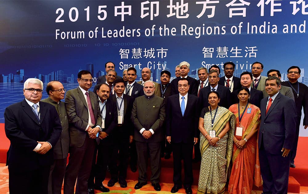 Prime Minister Narendra Modi and Chinese Premier Li Keqiang pose a group during the launch of India-China Forum of State & Provincial Leaders at the Great Hall of People in Beijing, China.